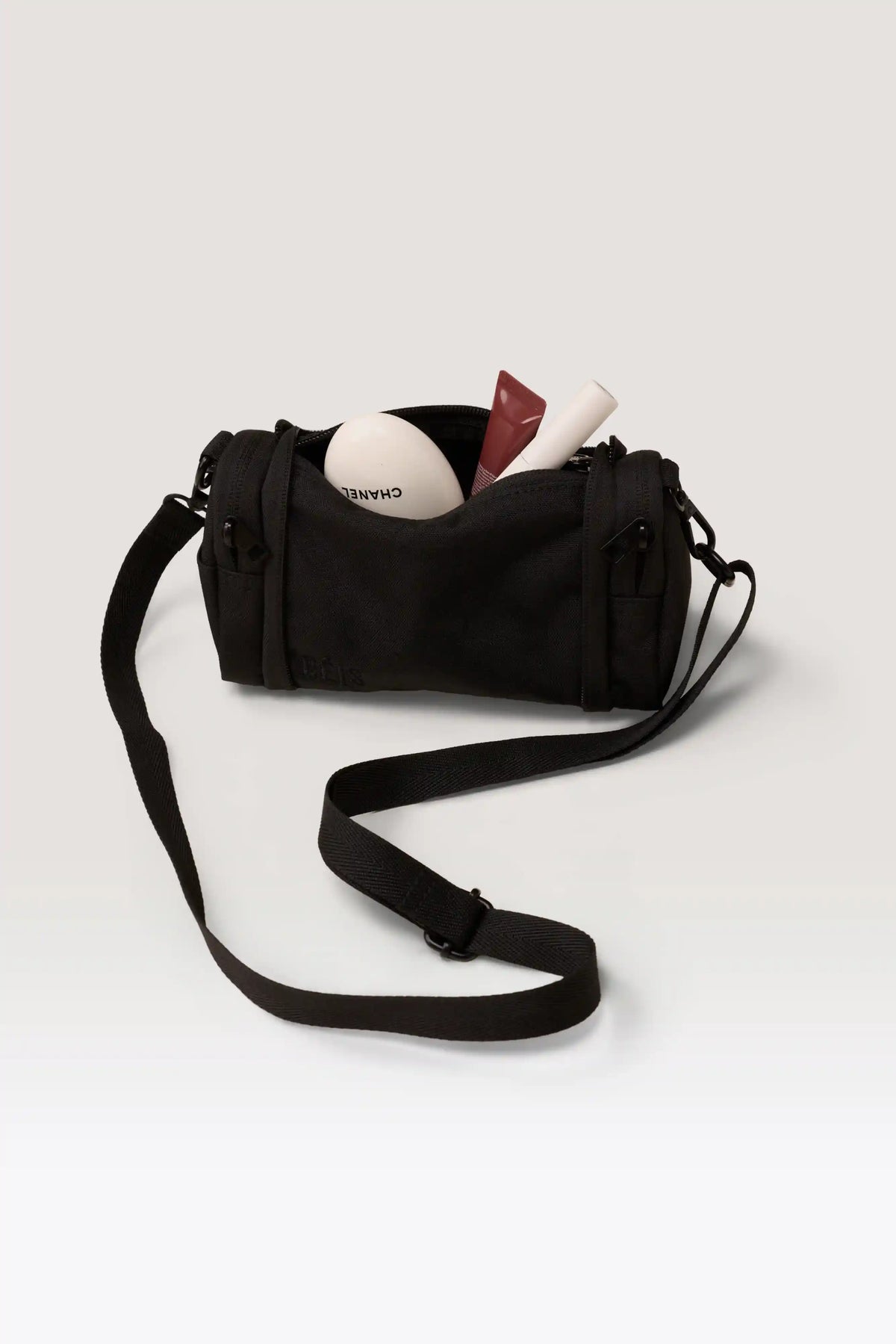 The Expandable Crossbody Charm in Black