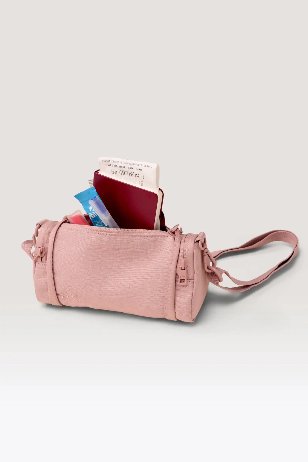 The Expandable Crossbody Charm in Atlas Pink